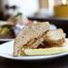 A tempeh reuben starts with marinated, baked tempeh and sauerkraut from The Brinery on house made rye bread with a tangy dressing. Melanie Maxwell | AnnArbor.com